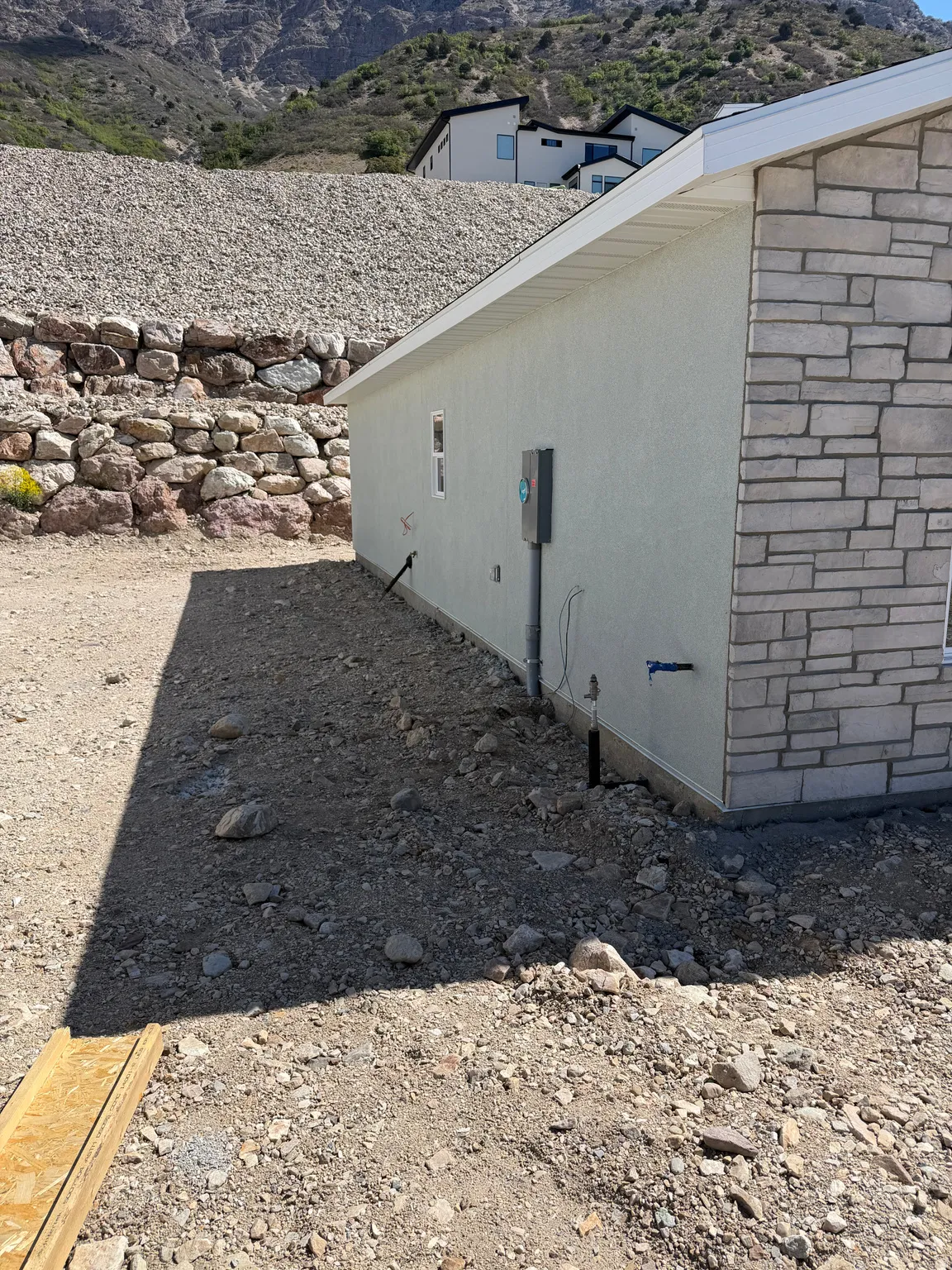 View of side of home featuring a mountain view and brick siding