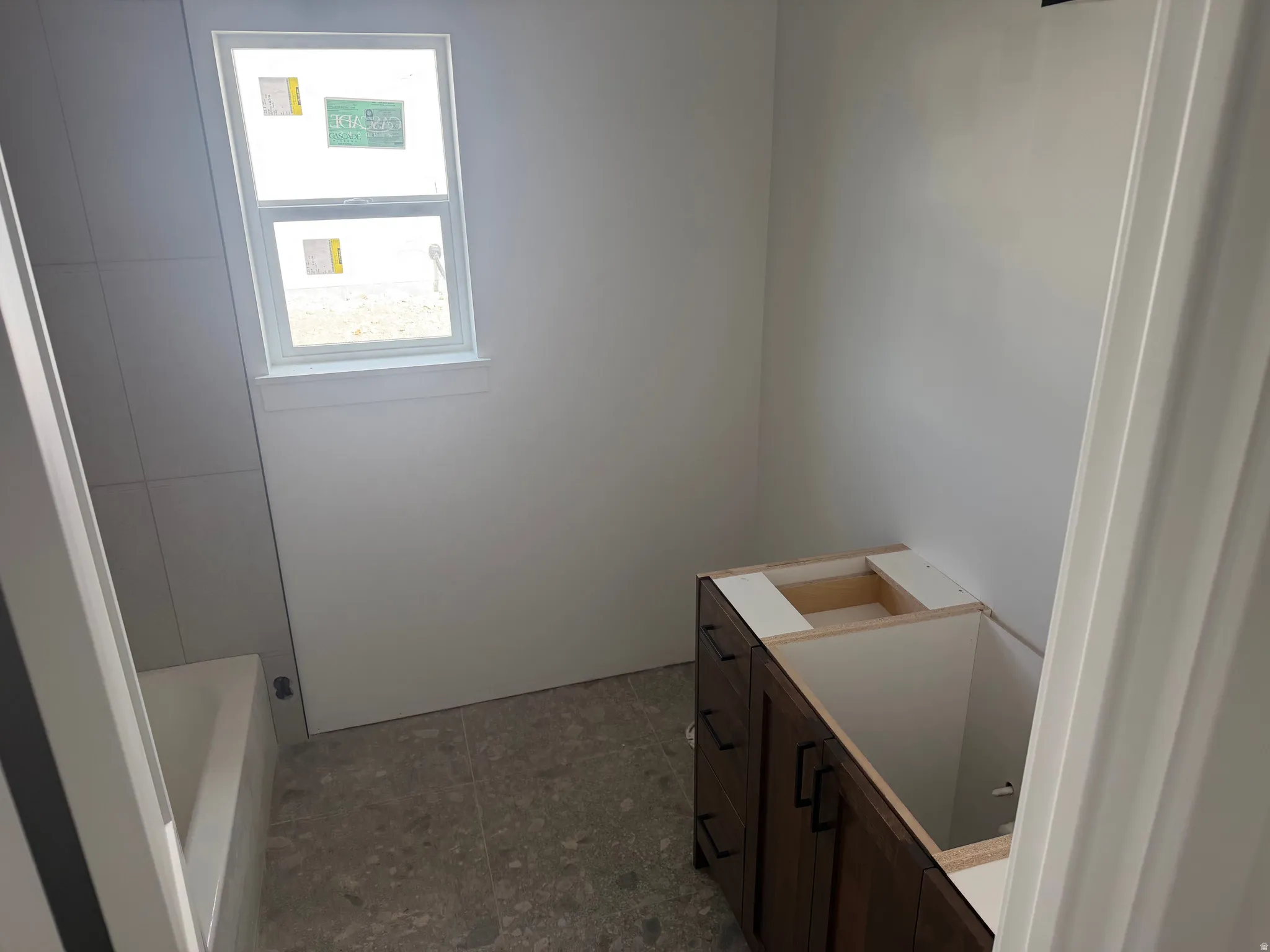 Full bathroom with vanity and a bathtub