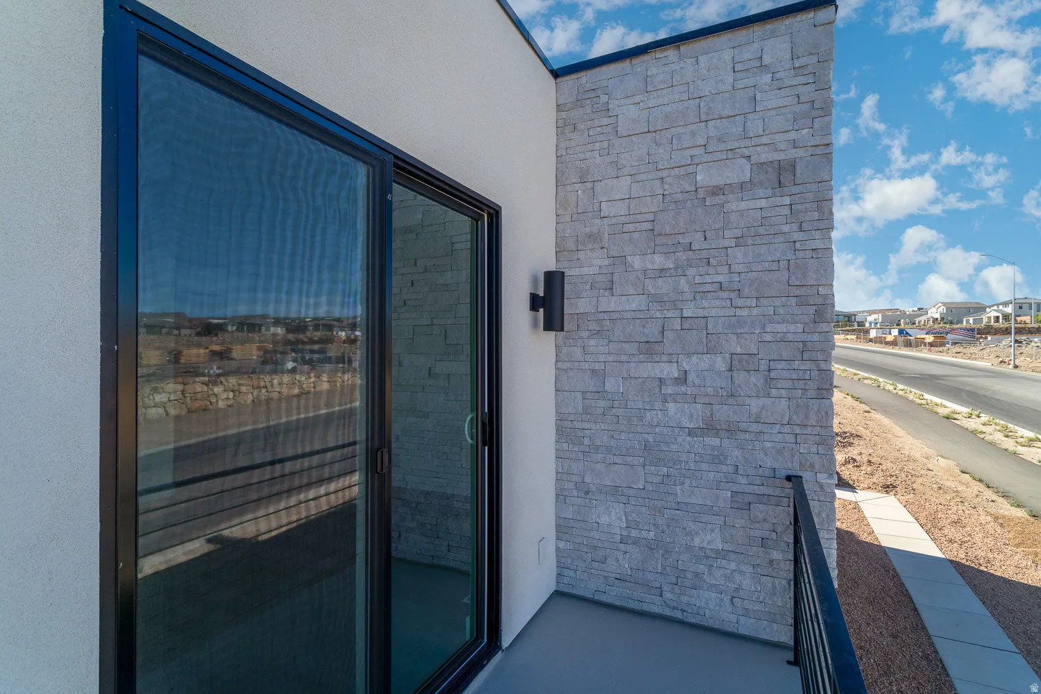 View of exterior entry with stucco siding
