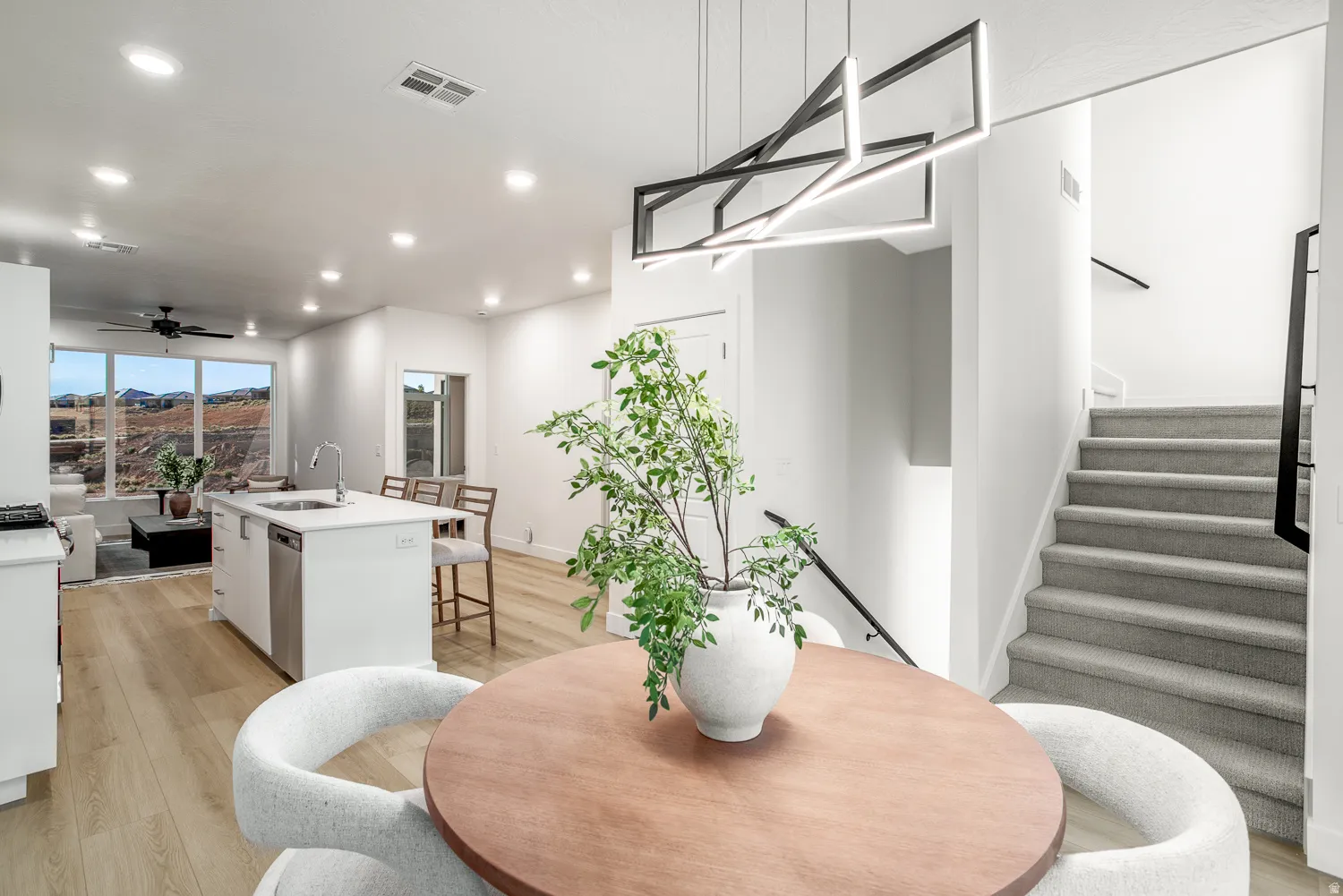 Dining space with ceiling fan, recessed lighting, light wood-type flooring, and a mountain view