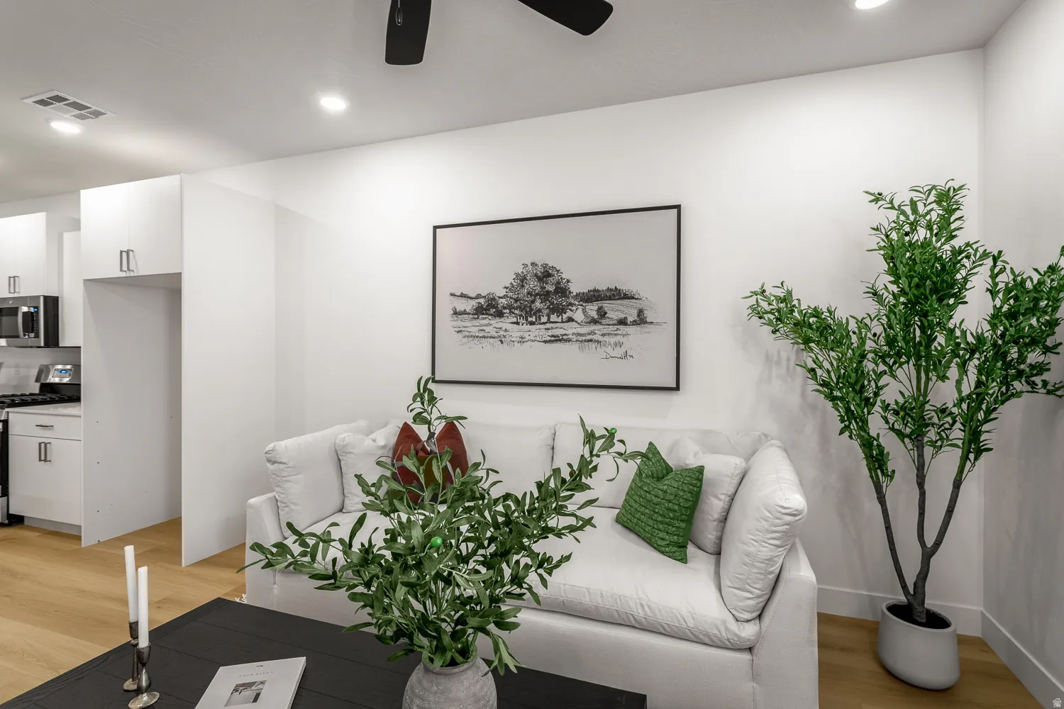 Sitting room with light wood-style flooring, recessed lighting, and a ceiling fan