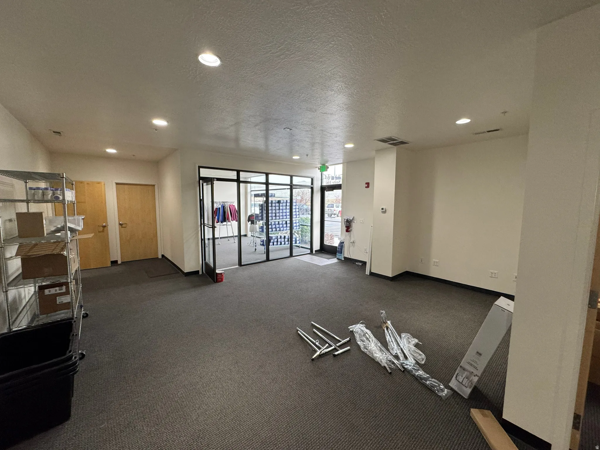 Workout area with a textured ceiling and recessed lighting