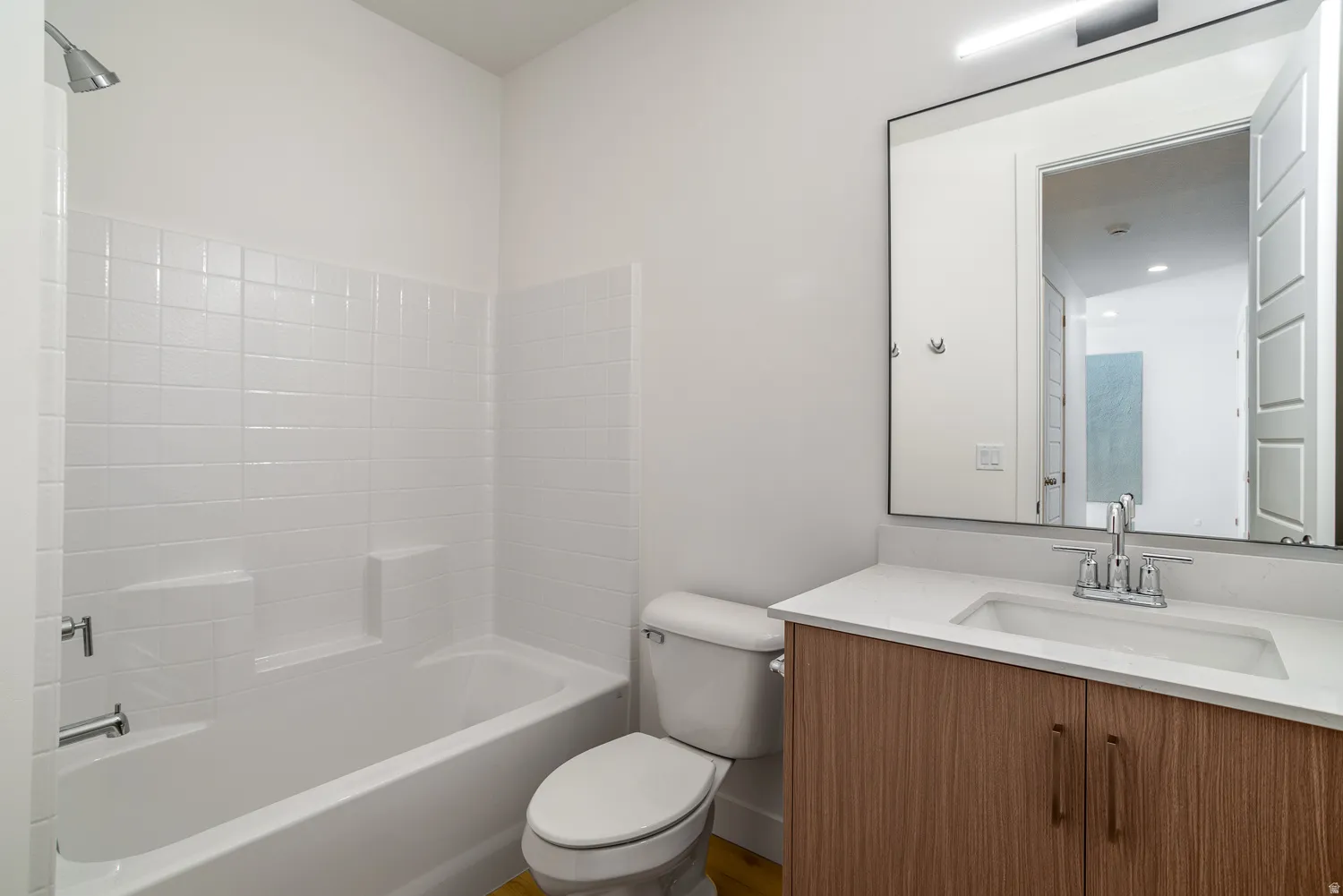 Full bath featuring vanity and tub / shower combination