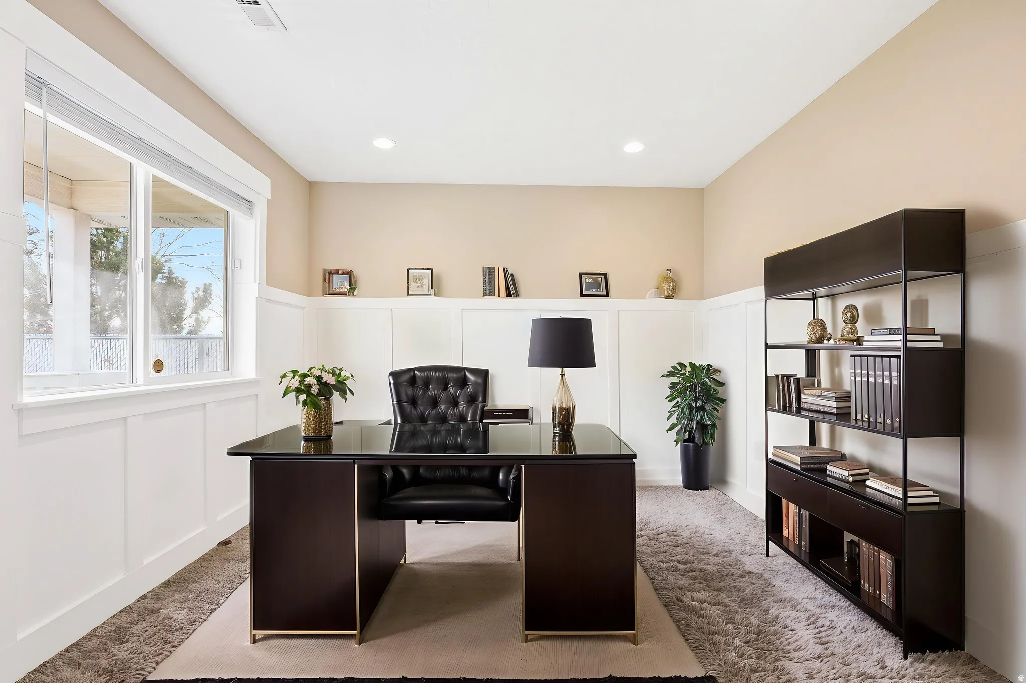 Home office featuring a decorative wall, a wainscoted wall, carpet flooring, and recessed lighting