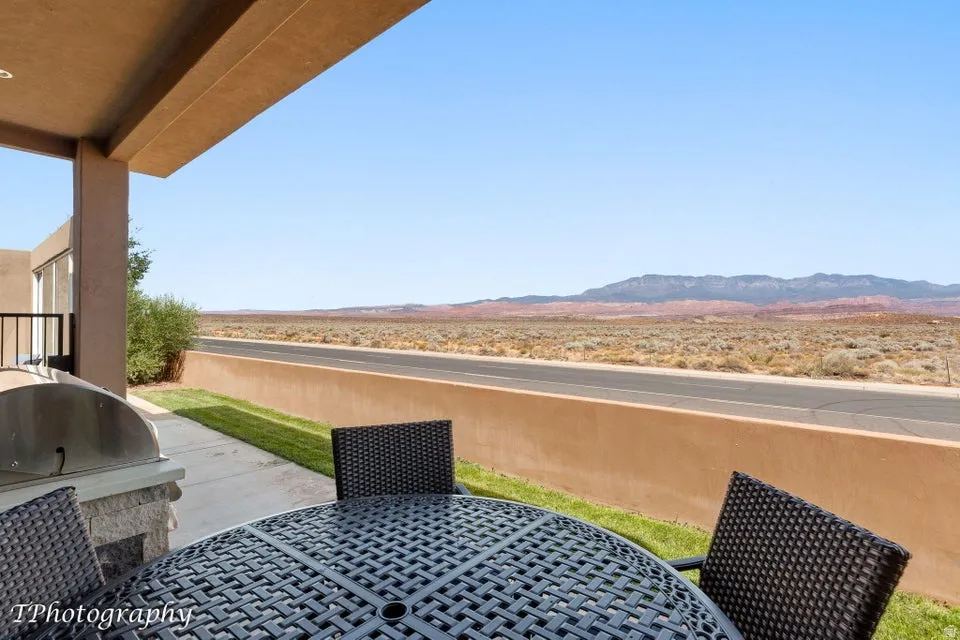 View of patio featuring a mountain view and a grill