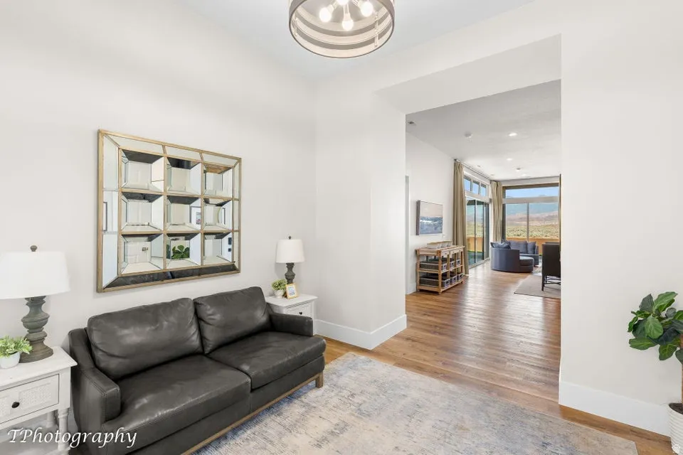 Living room featuring light wood finished floors and recessed lighting