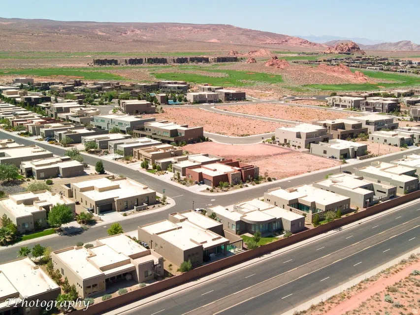 Aerial perspective of suburban area with a mountain backdrop