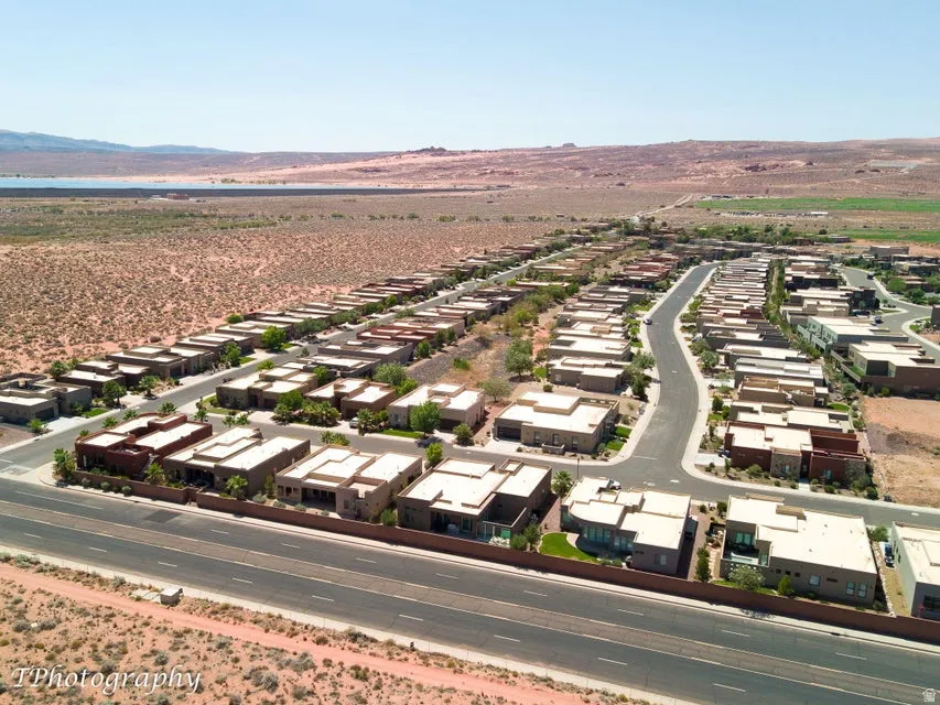 Aerial perspective of suburban area featuring a mountain backdrop