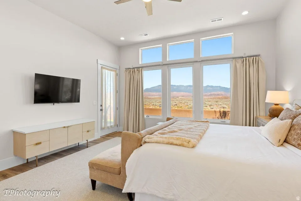 Bedroom featuring access to outside, light wood-style floors, recessed lighting, and ceiling fan
