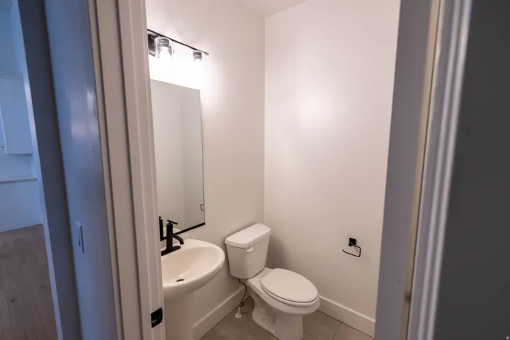 Bathroom featuring toilet and baseboards