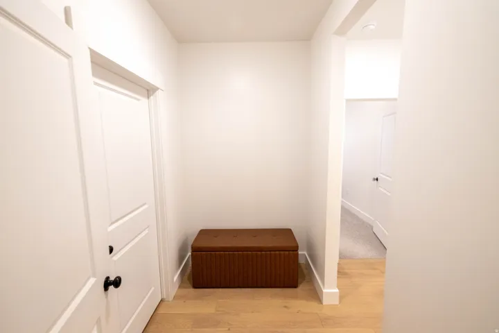 Hall featuring light wood-style floors and baseboards