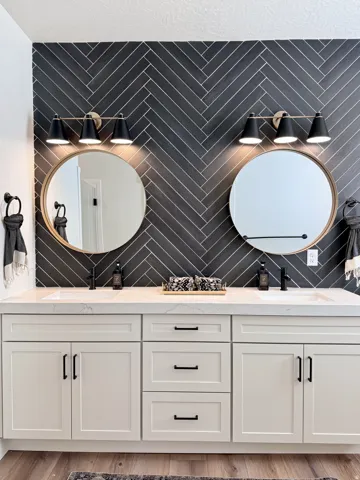 Full bathroom featuring double vanity and light wood-type flooring