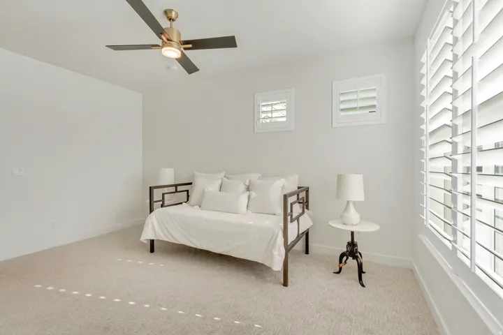 Bedroom with carpet flooring and ceiling fan