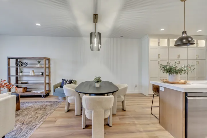 Dining area with recessed lighting and light wood-style flooring
