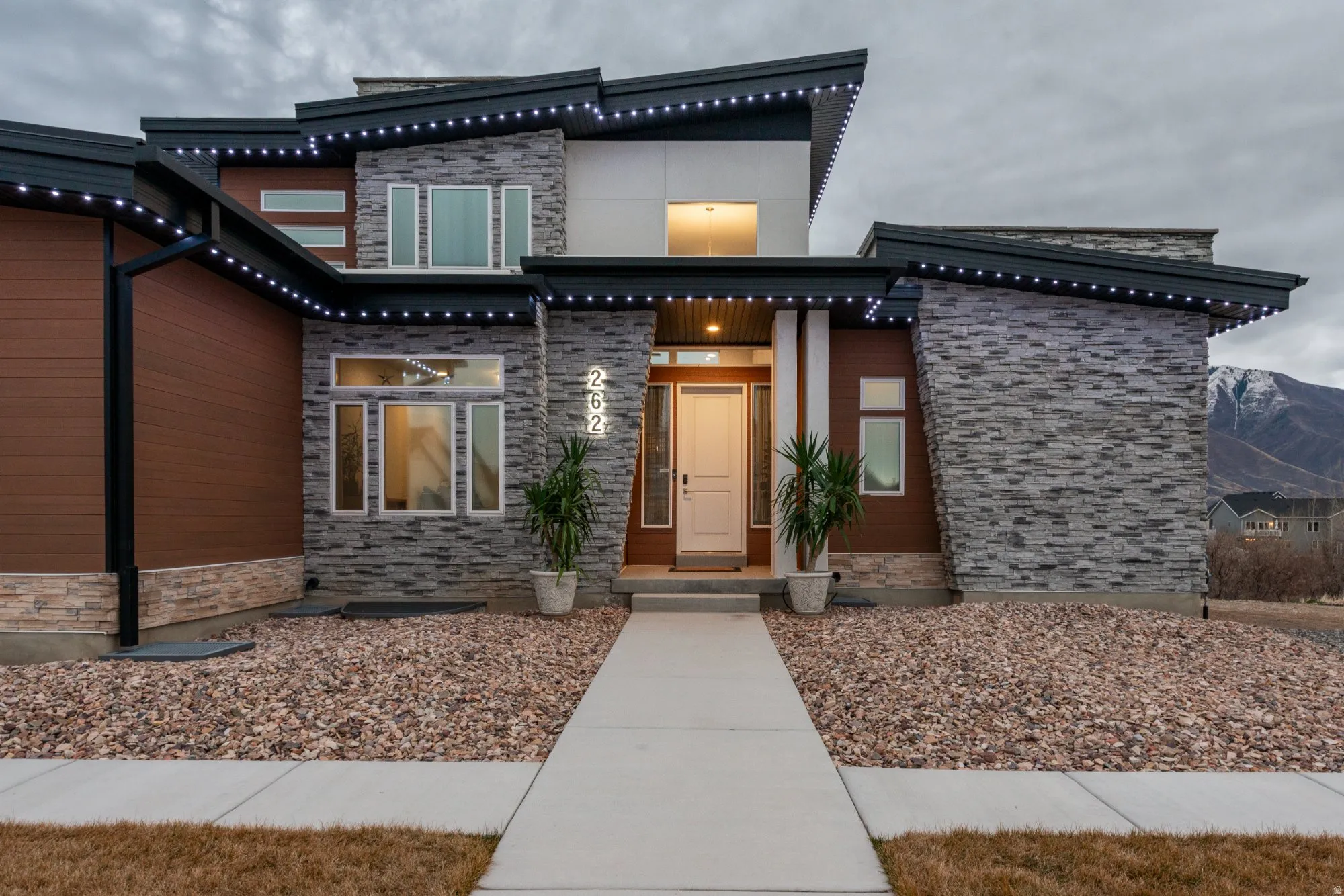 Property entrance featuring stone siding