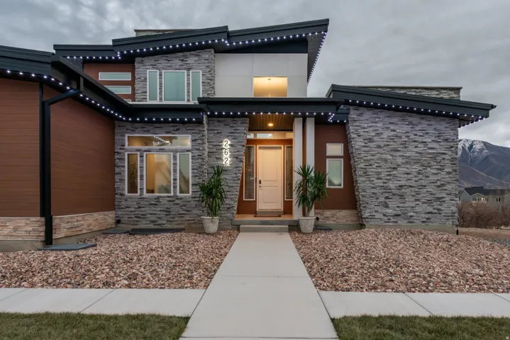 View of exterior entry with stone siding
