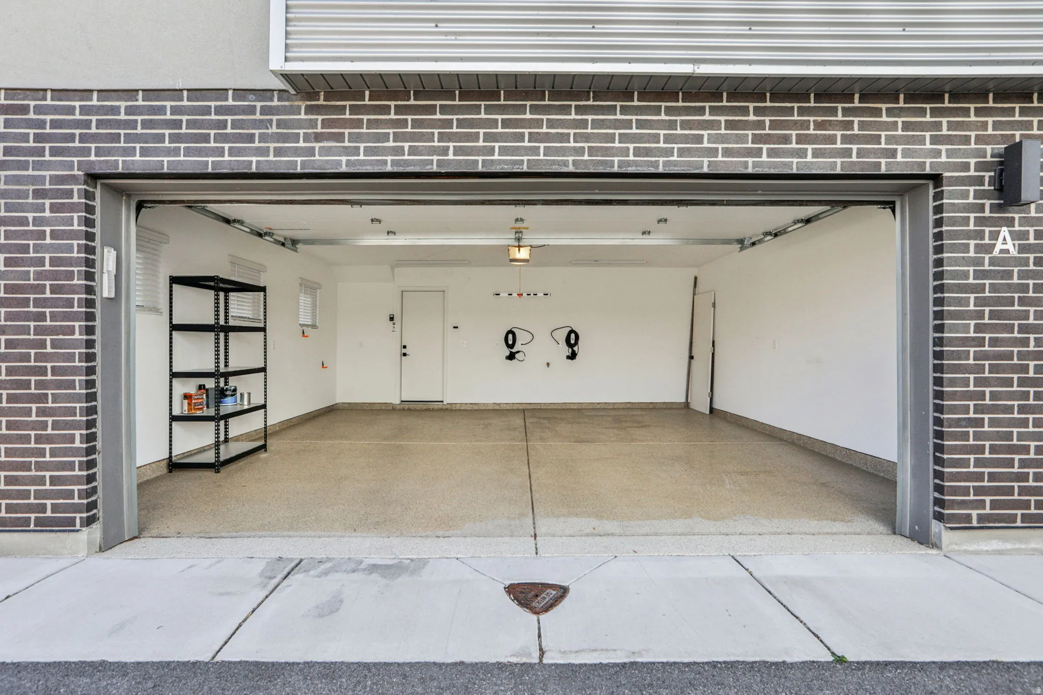 Garage featuring baseboards