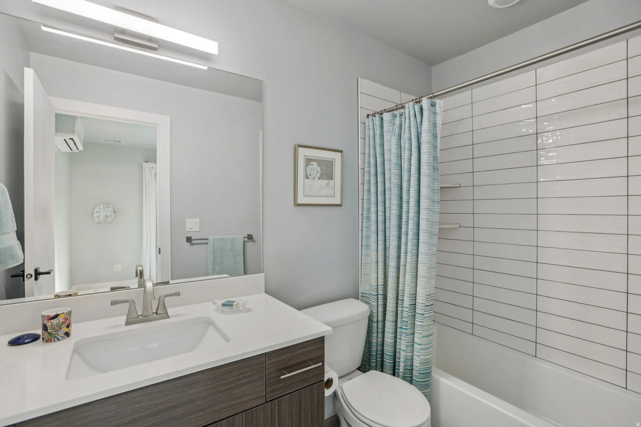 Full bathroom with vanity and shower / bath combo with shower curtain