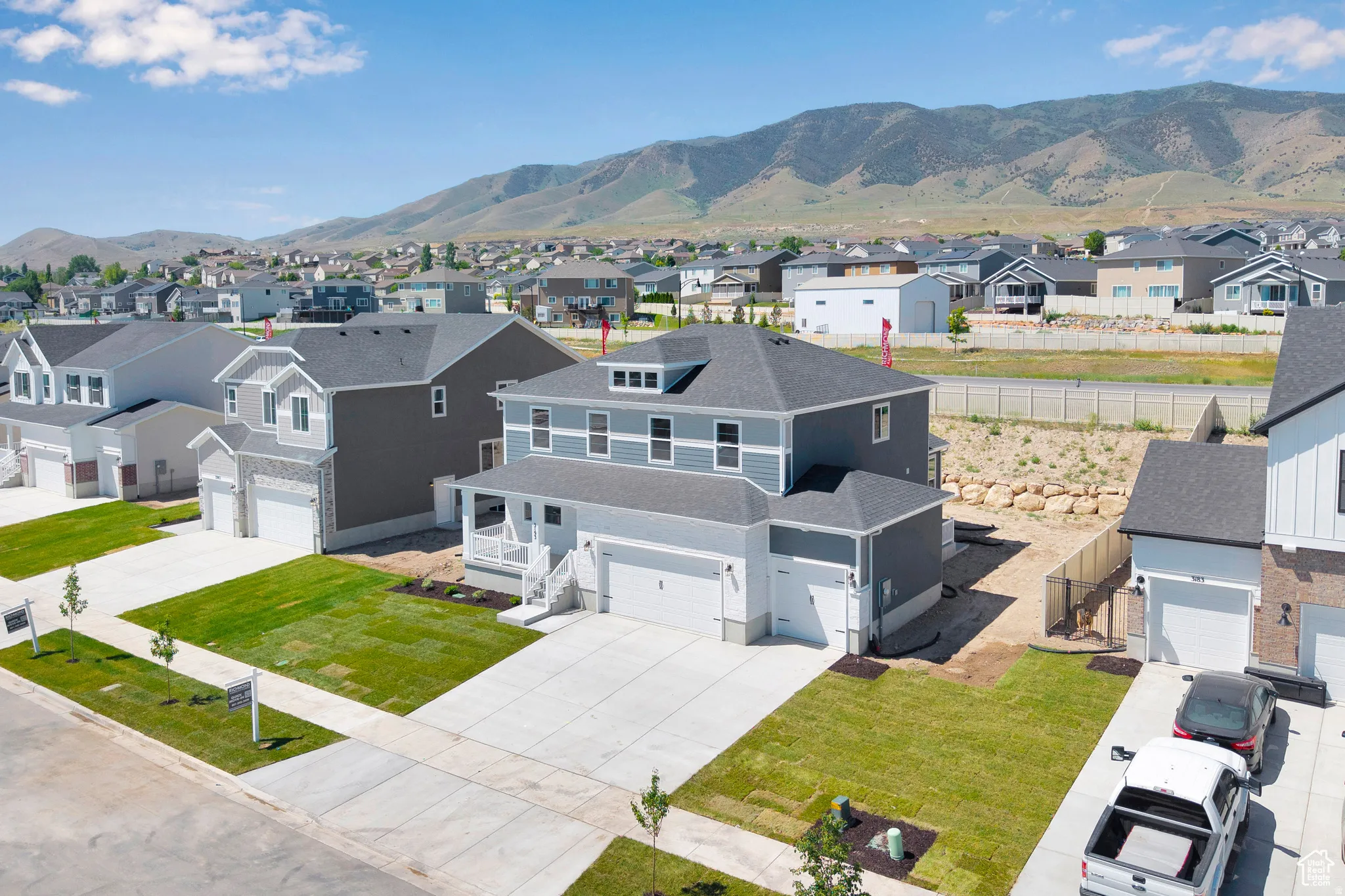 Aerial view of residential area featuring a mountain backdrop