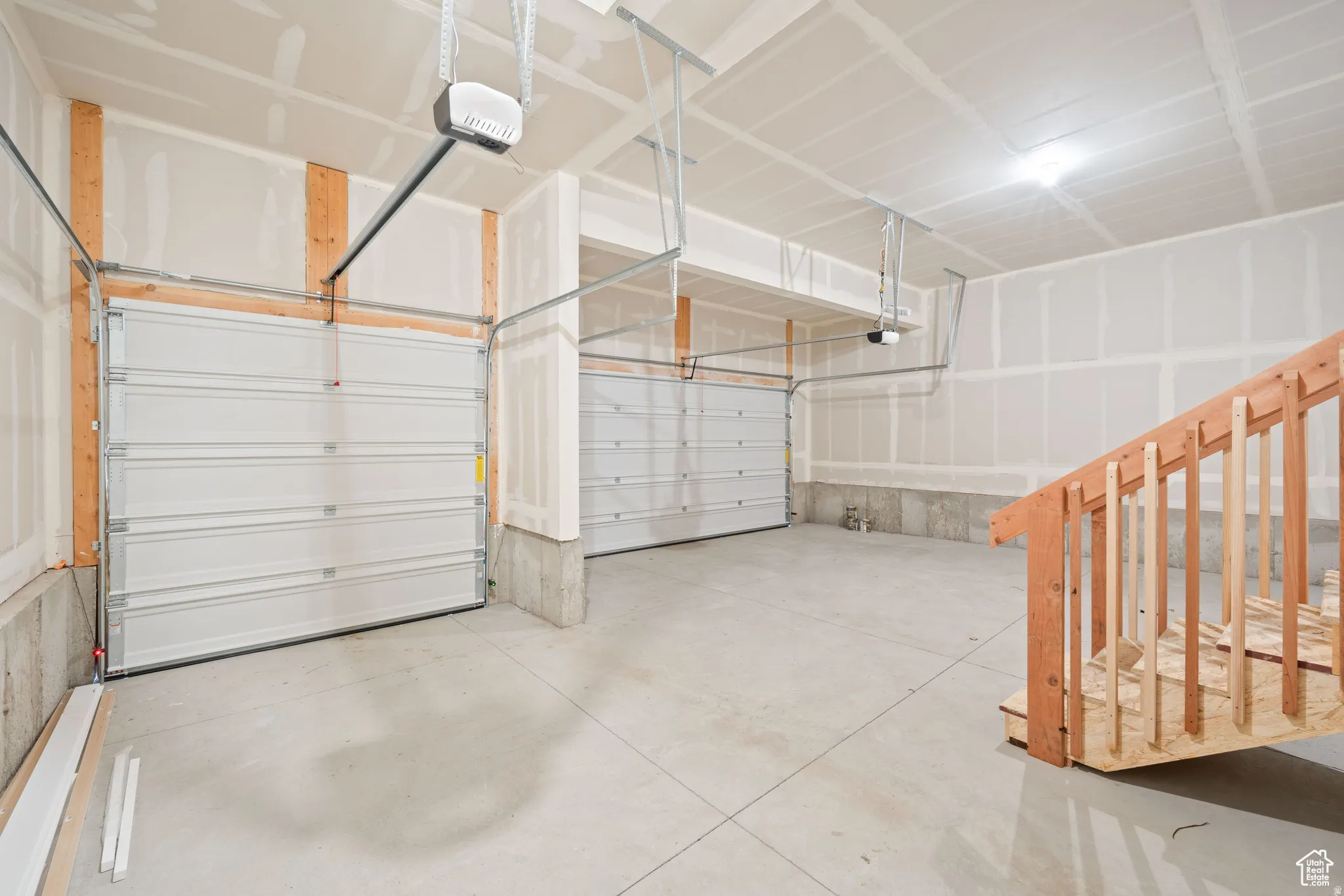 Garage featuring a garage door opener