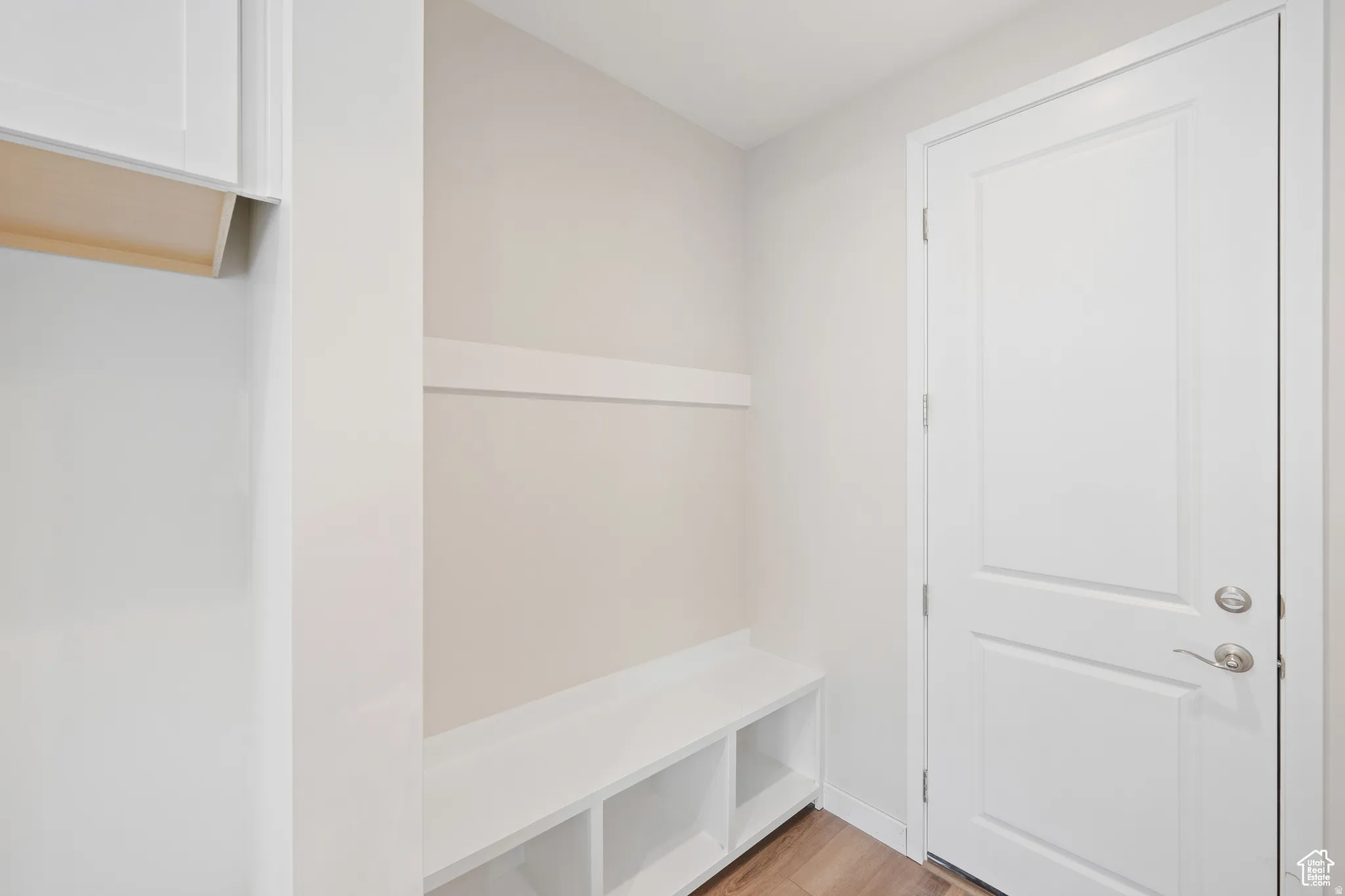 Mudroom with light wood-style flooring