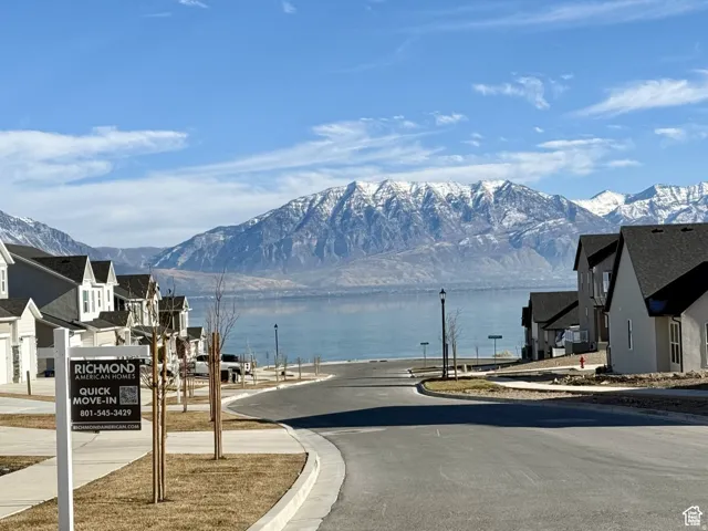Water view with mountains and nearby suburban area