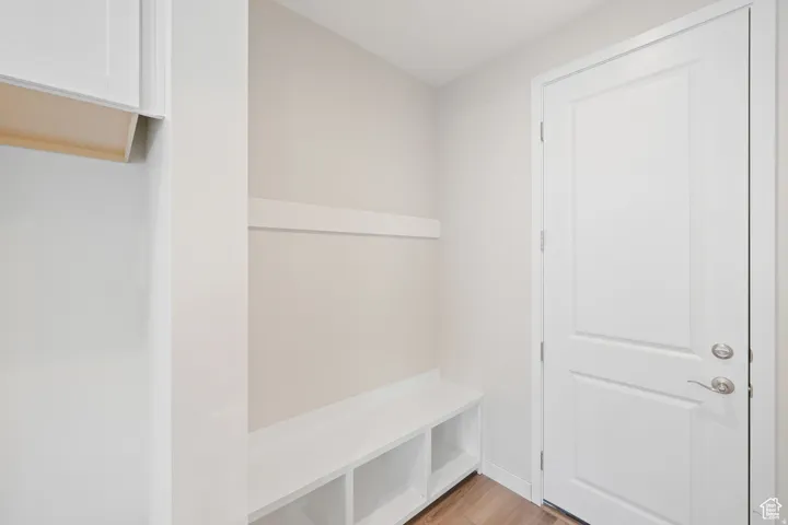 Mudroom with light wood-style flooring