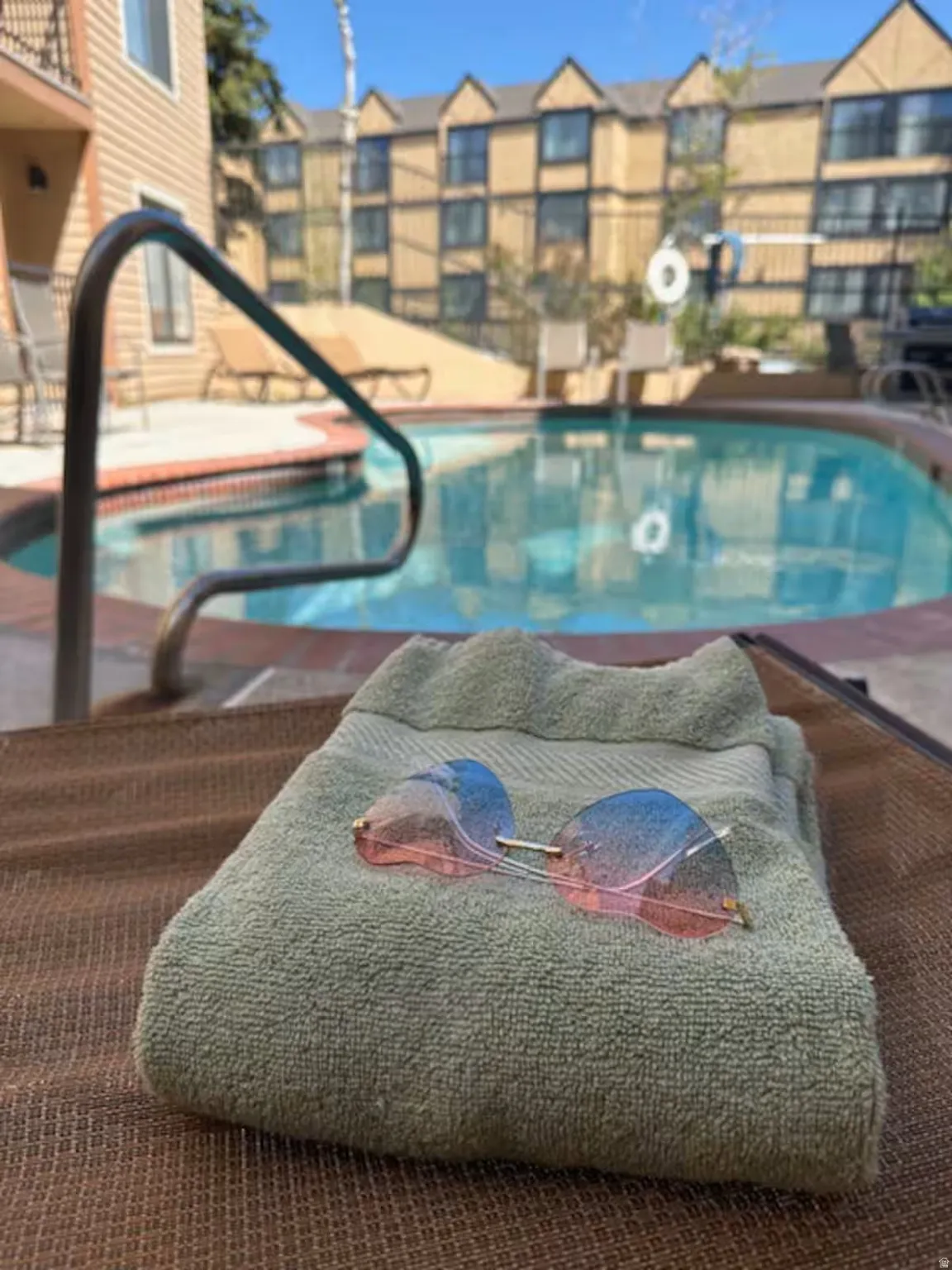 Community pool featuring a patio
