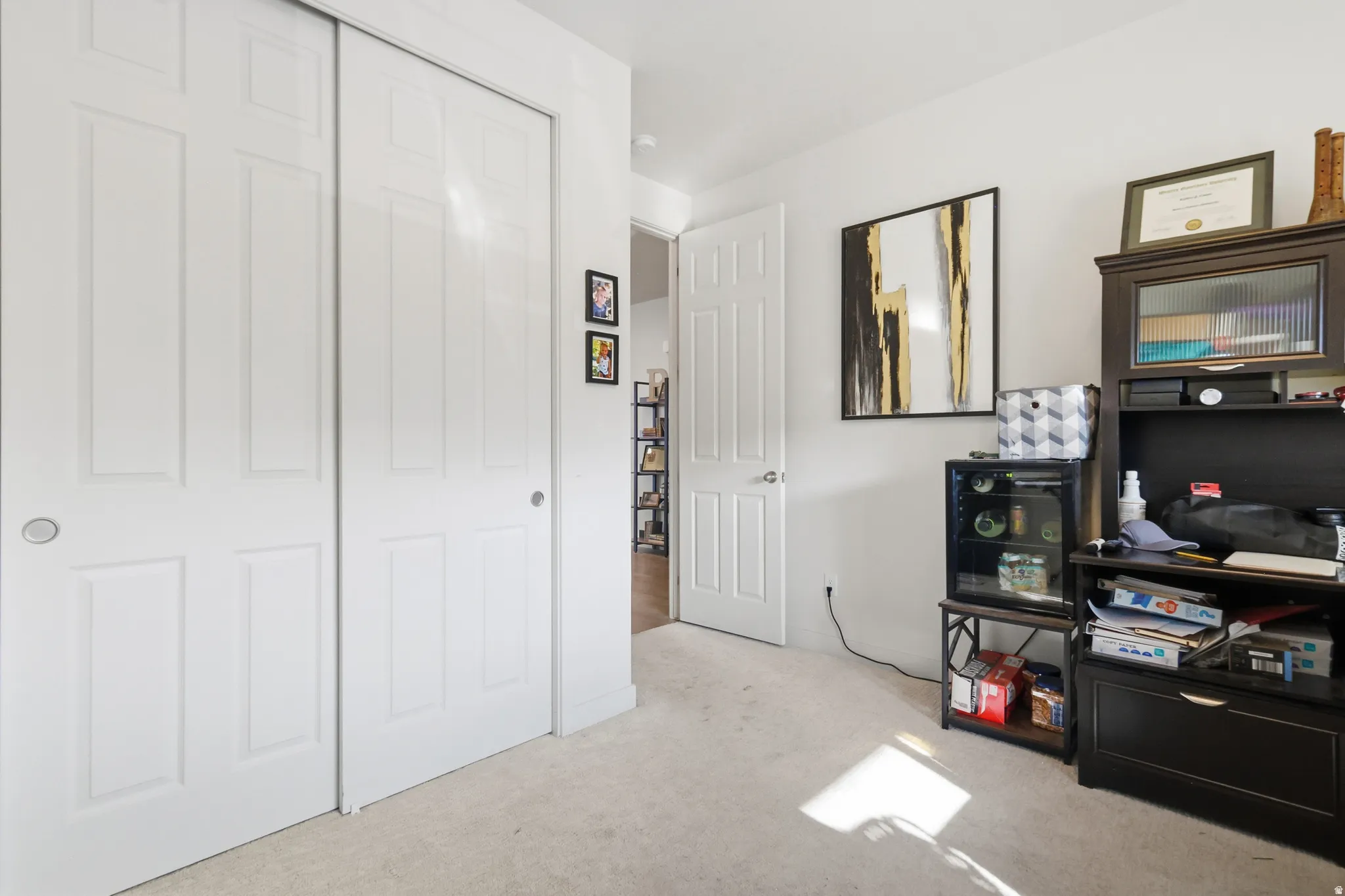 Bedroom/Office space with light colored carpet