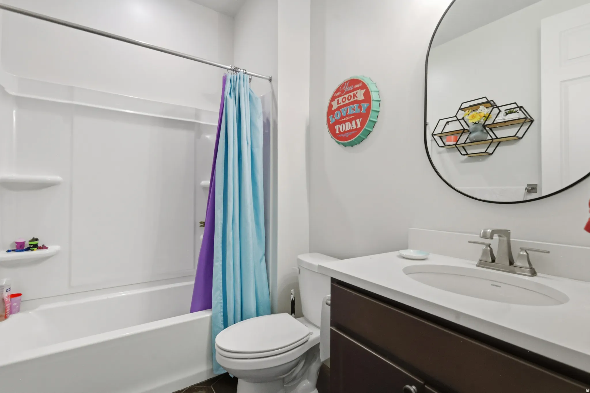 Full bathroom featuring vanity and shower / tub combo with curtain