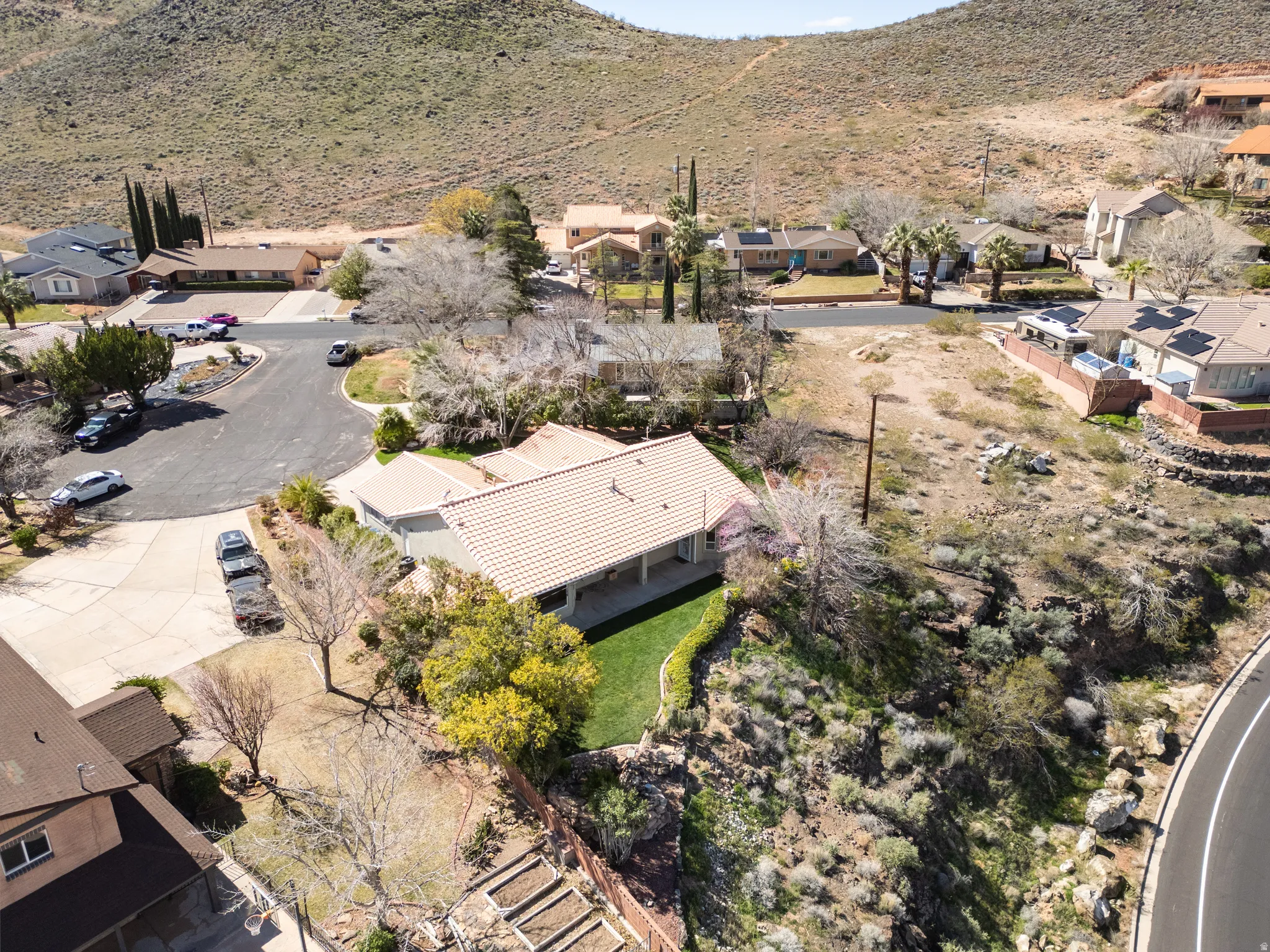 Aerial view of residential area featuring a mountain backdrop