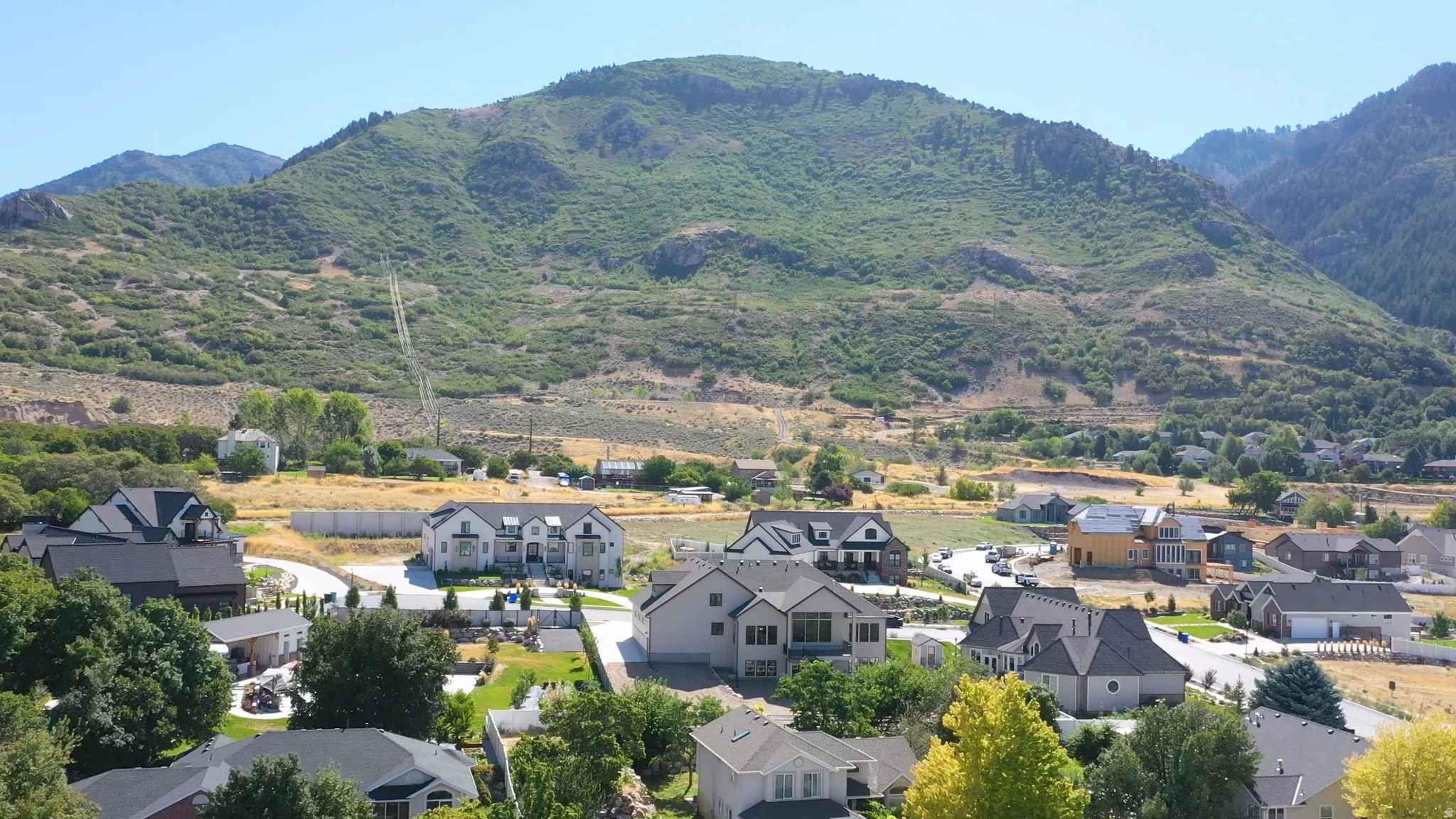 Residential properties set against a mountainous backdrop