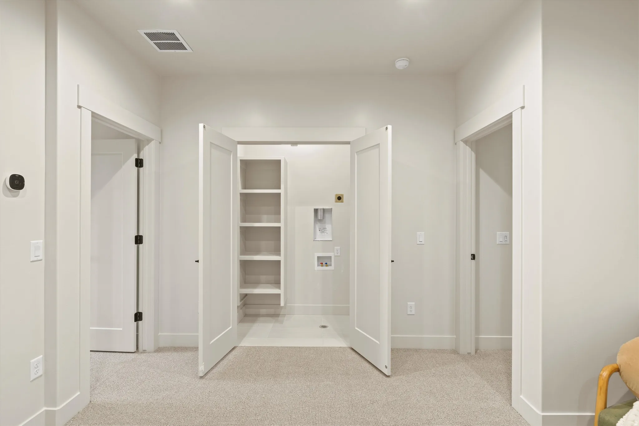 Unfurnished bedroom featuring light colored carpet
