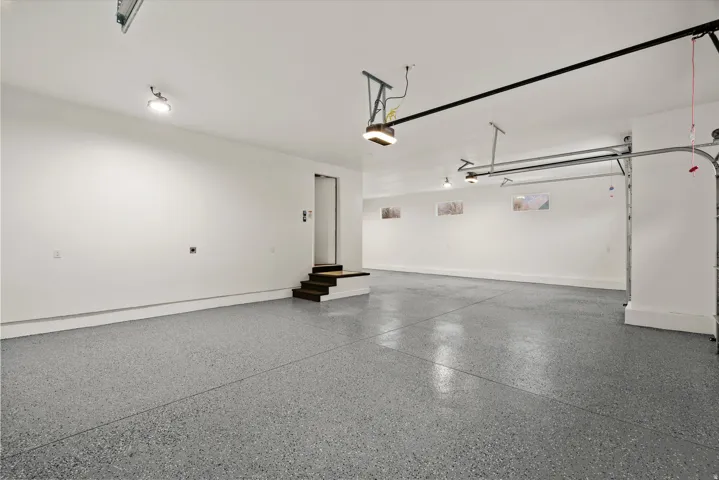 Garage featuring baseboards