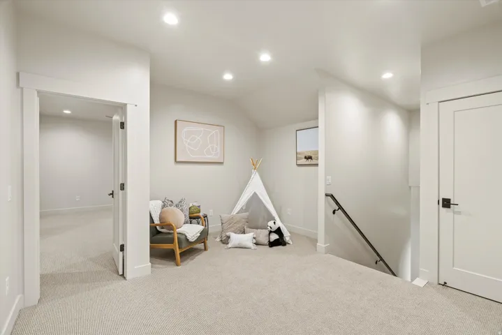 Playroom with recessed lighting and carpet