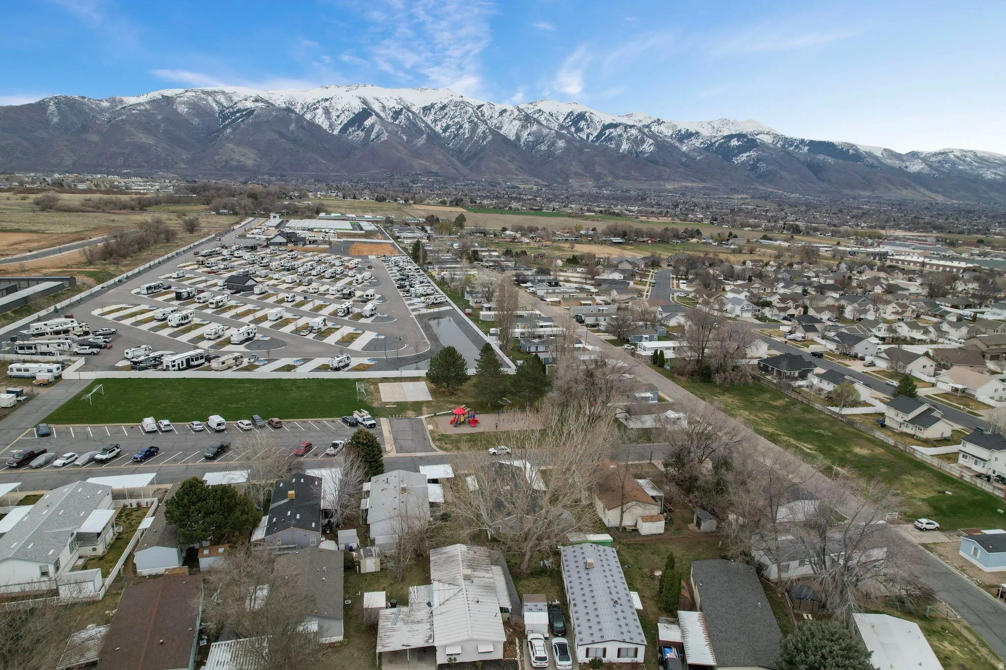Aerial view of residential area featuring a mountain backdrop