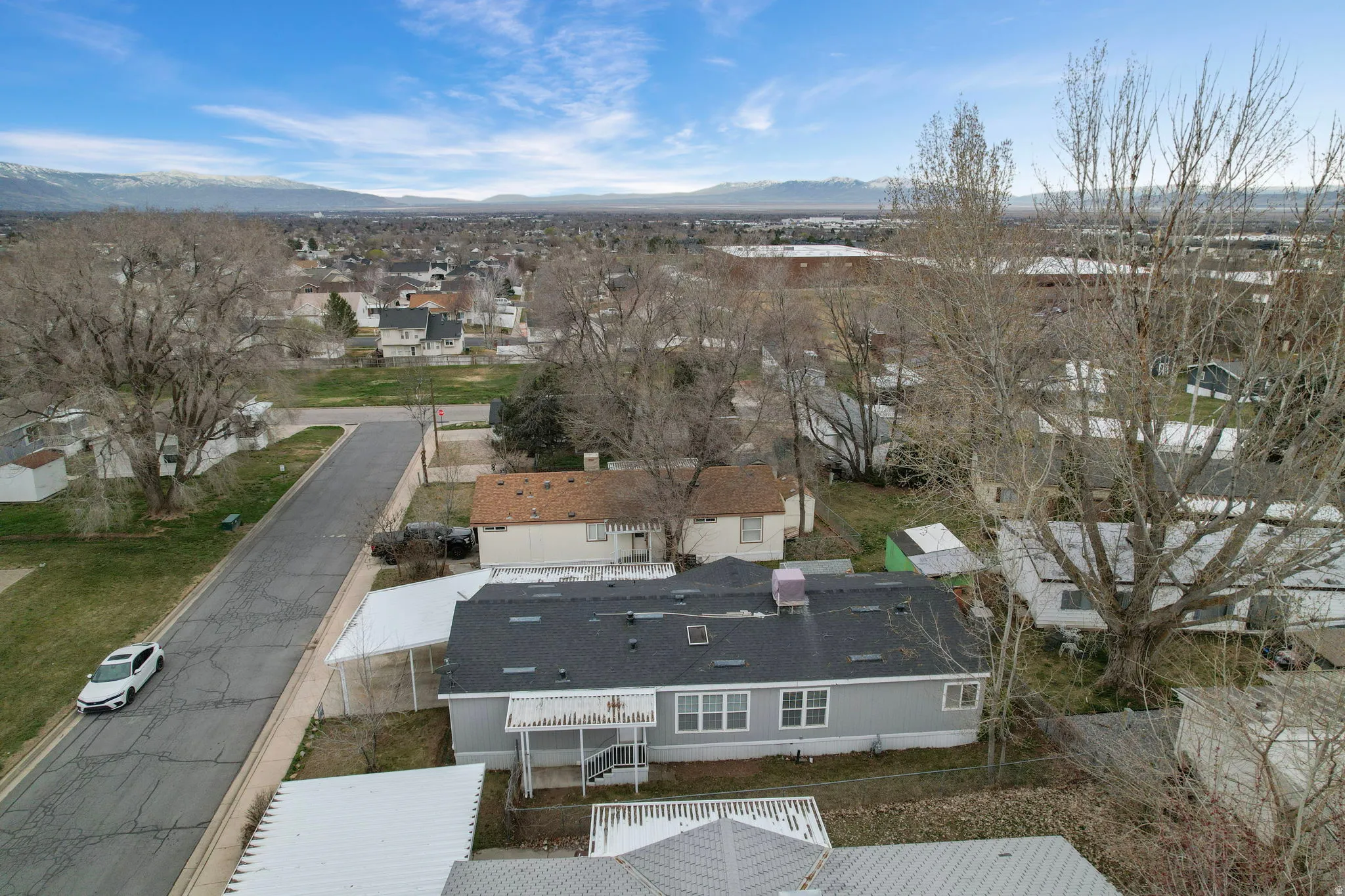 Aerial perspective of suburban area featuring mountains