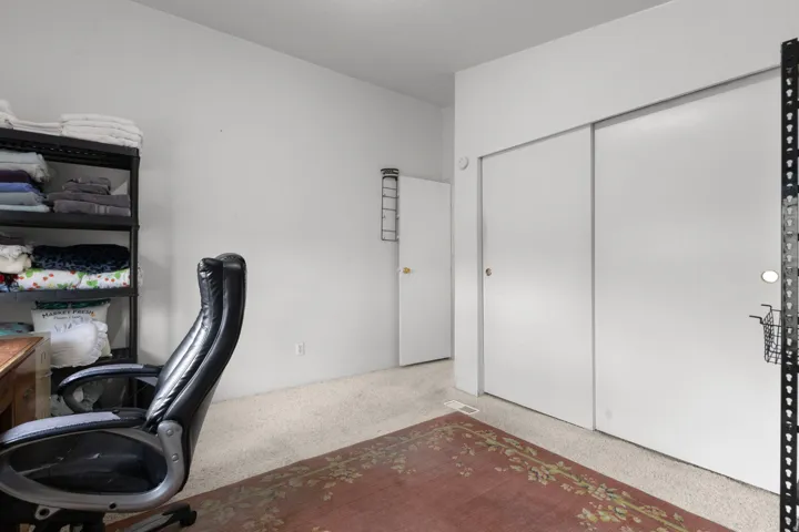 Office area with light colored carpet