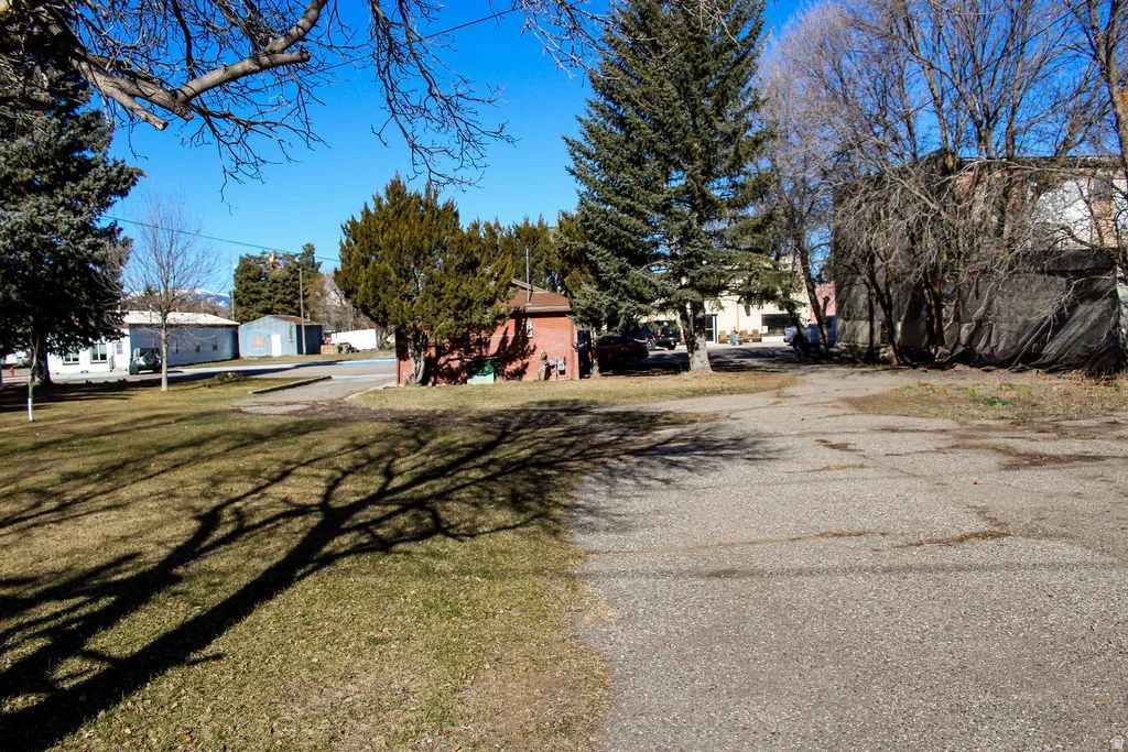 View of asphalt road with a residential view