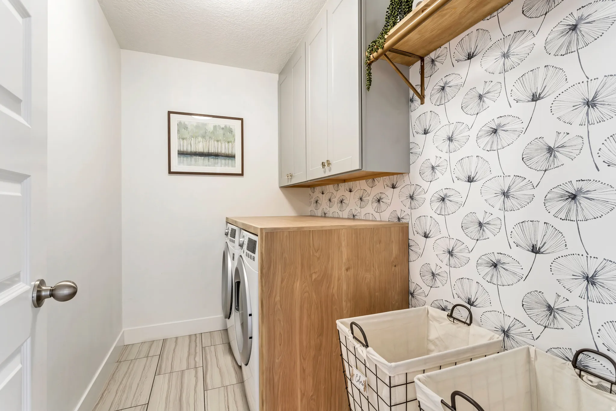 Laundry area featuring a washer and dryer and built-in counter