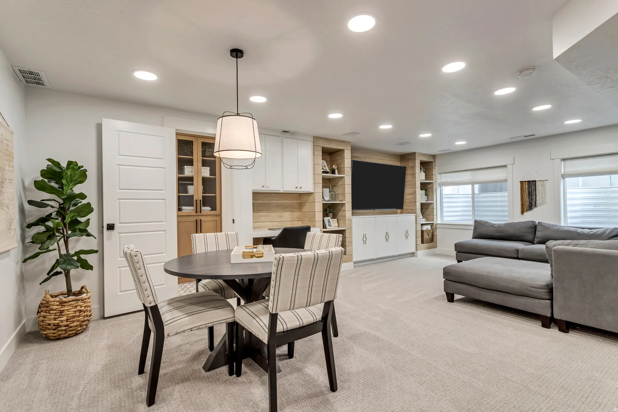 Dining room featuring recessed lighting and light colored carpet