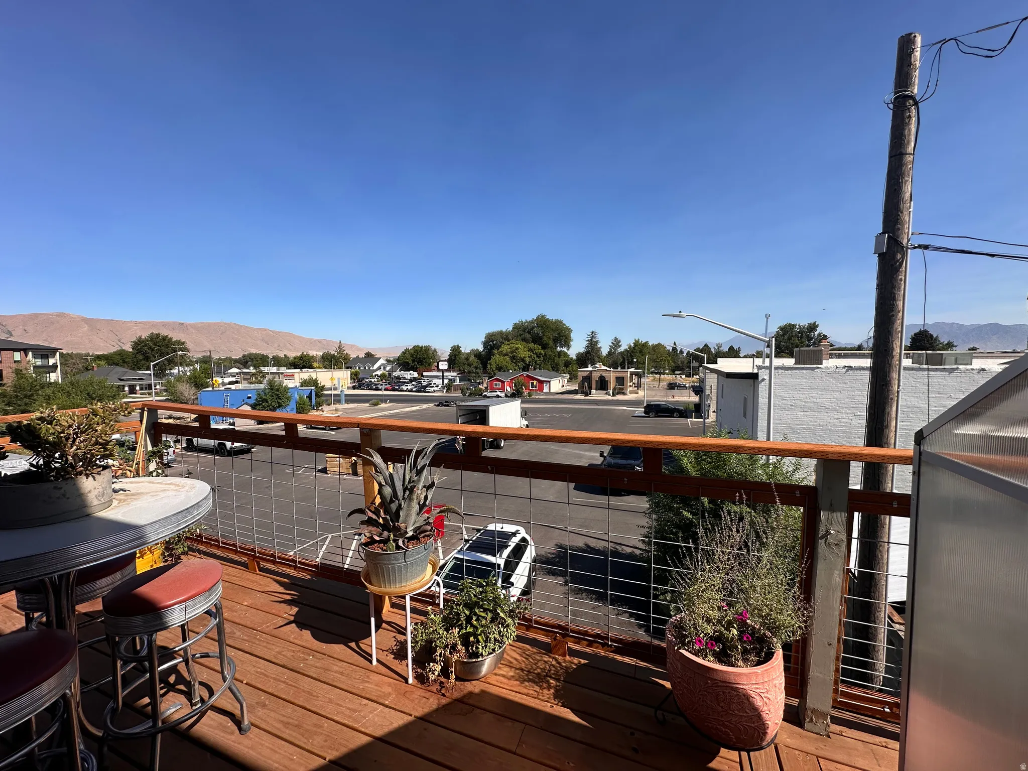 Deck featuring a mountain view and a residential view