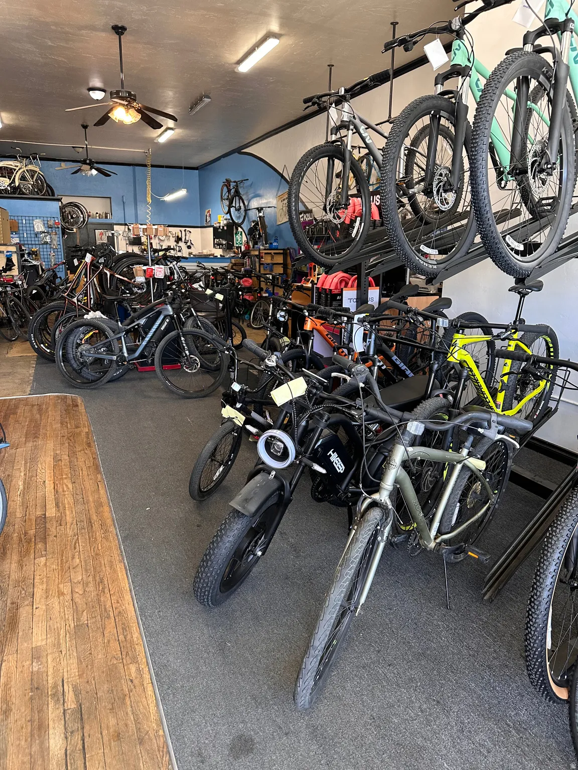 Garage featuring ceiling fan and bike storage
