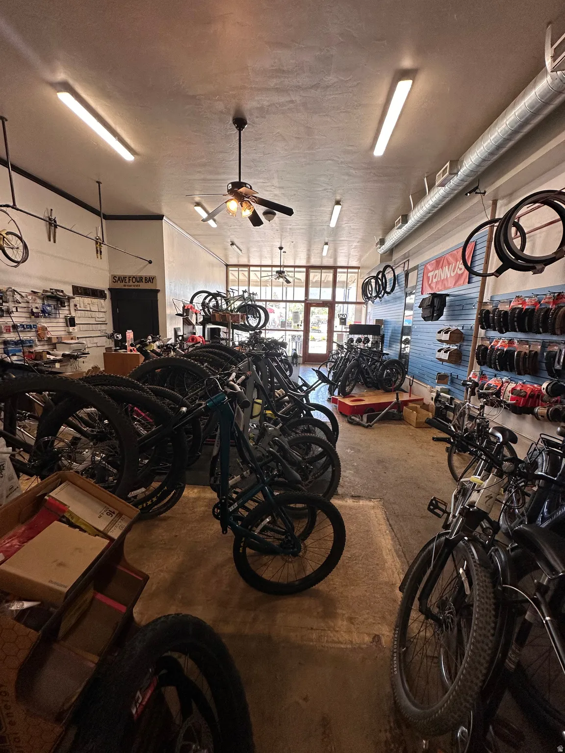 Garage featuring a ceiling fan and bike storage