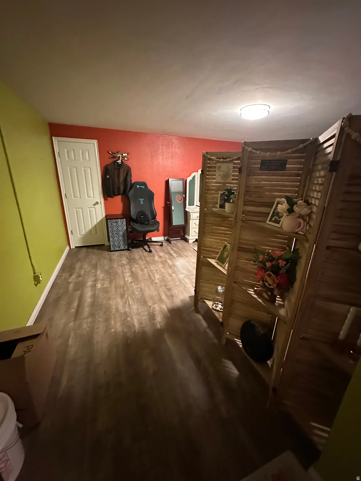 Office space with baseboards and dark wood-style flooring
