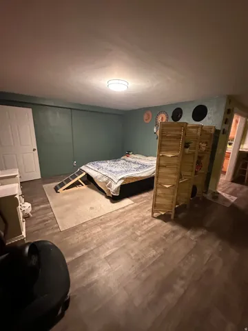 Bedroom featuring dark wood finished floors