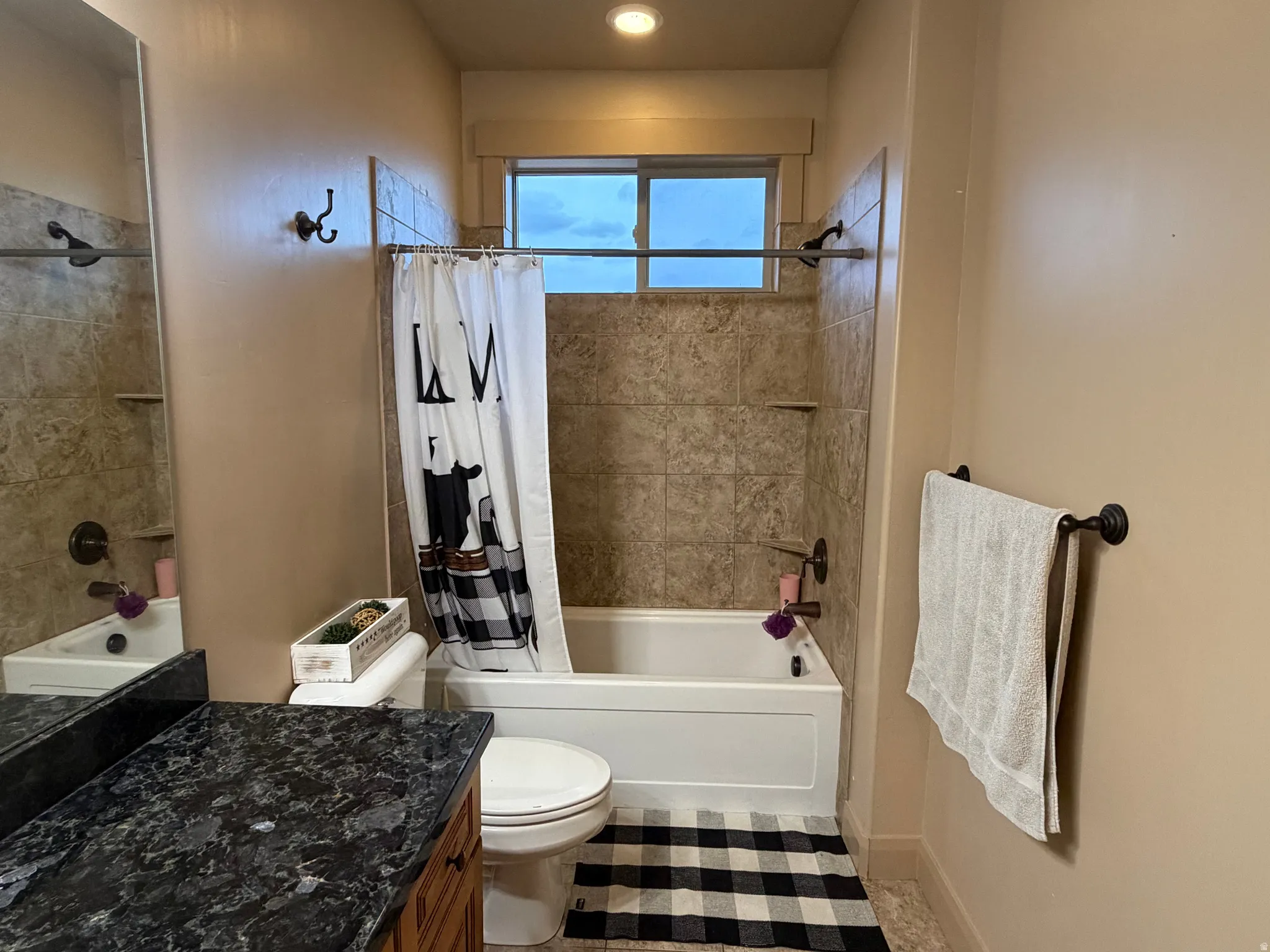 Full bathroom with vanity and shower / bathtub combination with curtain