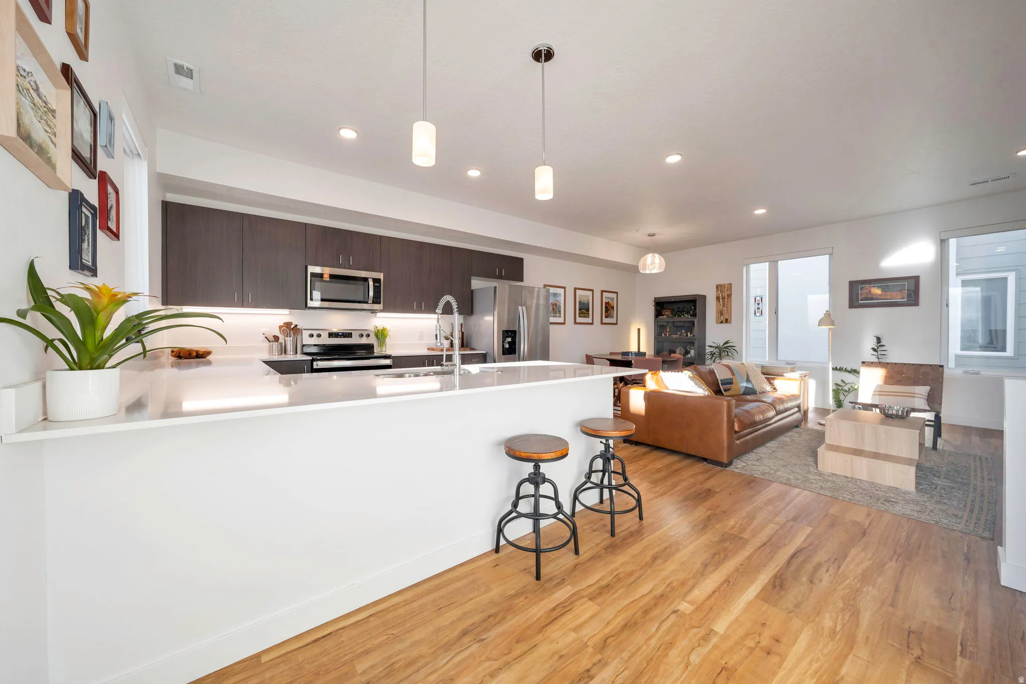 Well lit main floor is open with breakfast bar and modern kitchen.