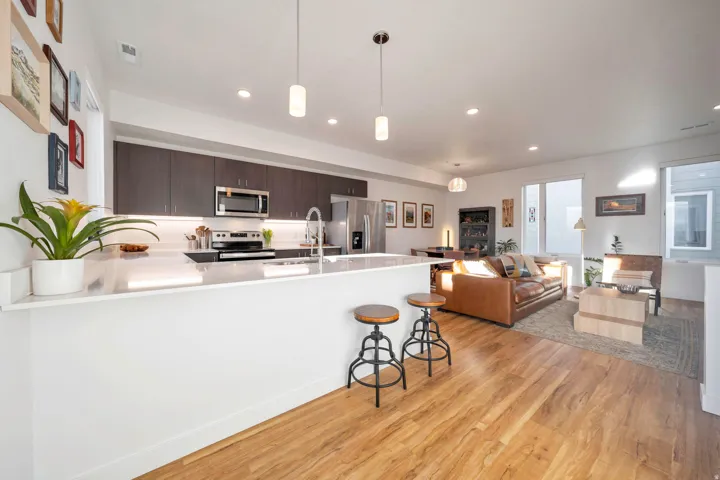 Well lit main floor is open with breakfast bar and modern kitchen.