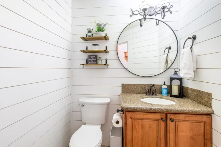 Bathroom with wooden walls and vanity